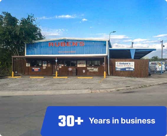 outside view of Ruben's Auto Repair shop and a blue rectangle box at the bottom with the text "30+ Years in business"